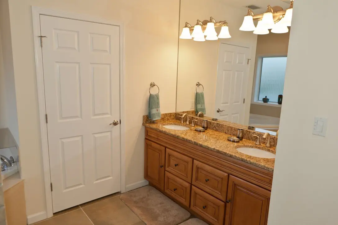 Master bathroom with granite double vanity, Happy Island Cottage