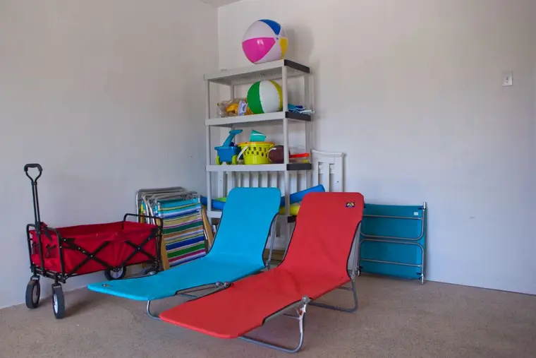 Beach toys, loungers, and a beach wagon left by past guests in the garage, free to use, Happy Island Cottage