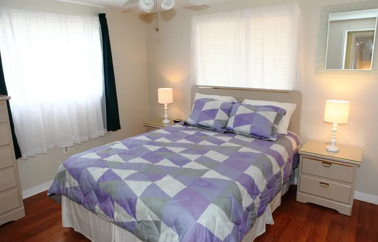 Second queen bedroom, view across the bed to the window, Happy Turtle B