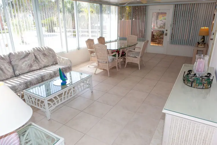 Florida room seating area with wicker furniture, Happy Turtle A