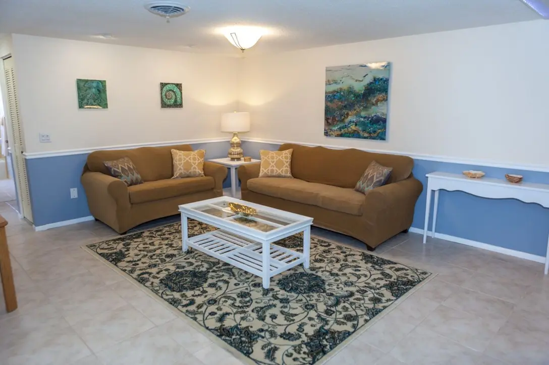 Living room with two sofas and white coffee table, Happy Turtle A