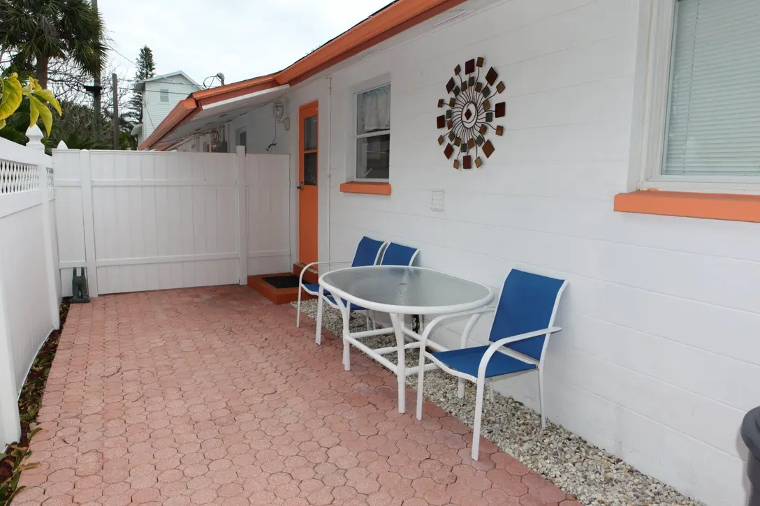 Private brick patio with outdoor dining table beside Happy Turtle B