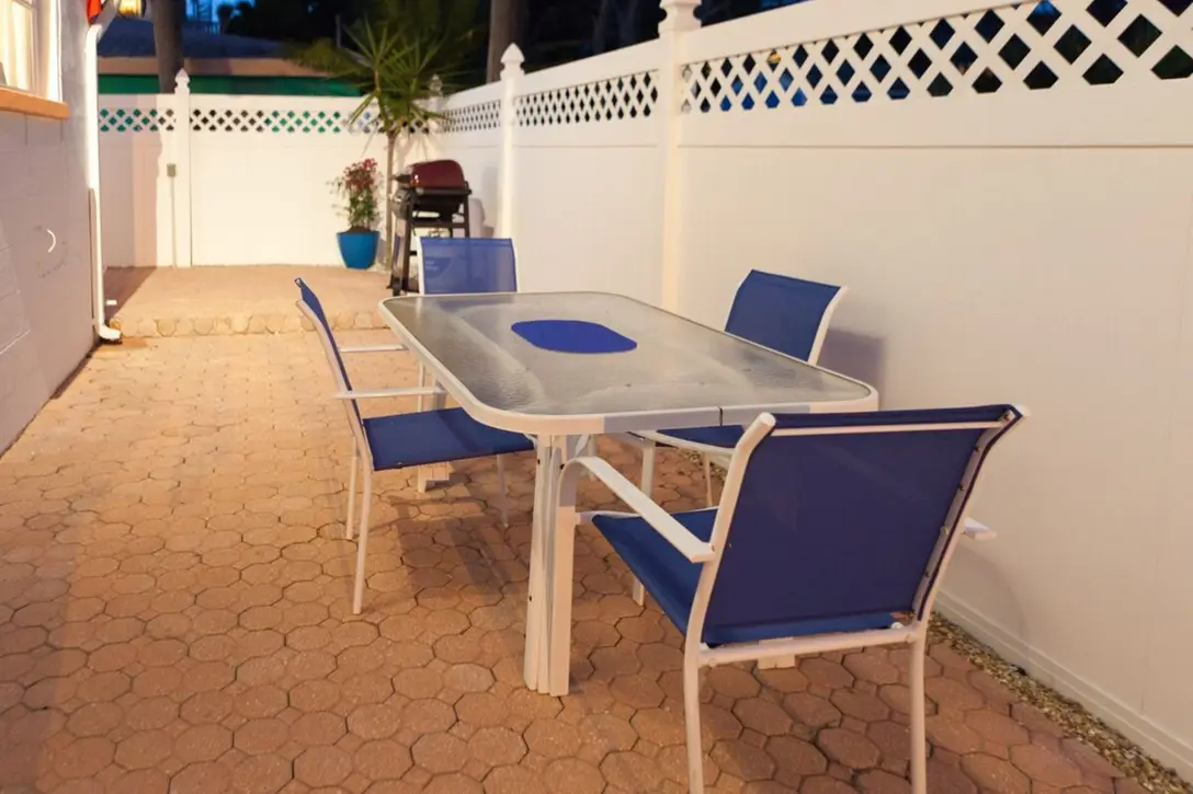 Private paver patio with table and blue chairs, Happy Turtle A
